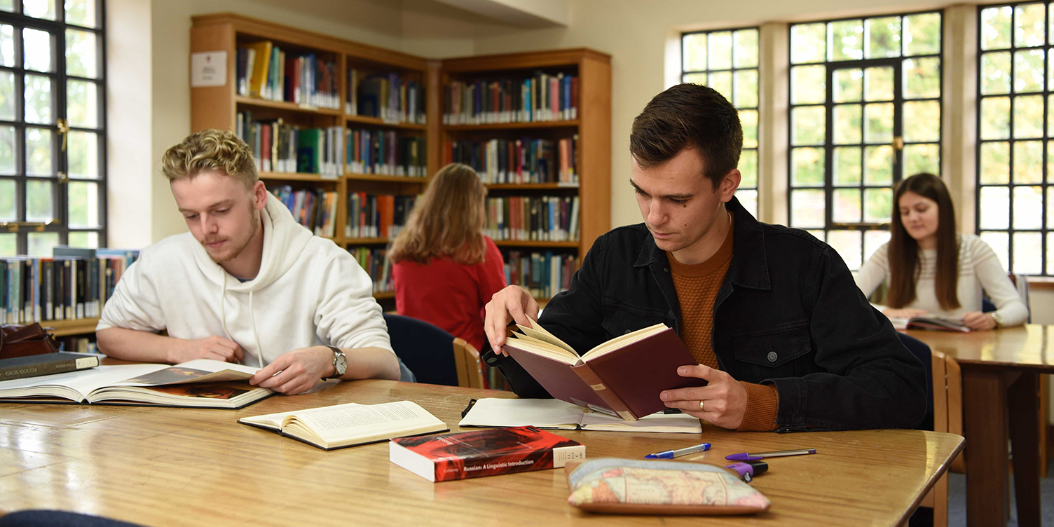 Students studying in a Trinity College library space